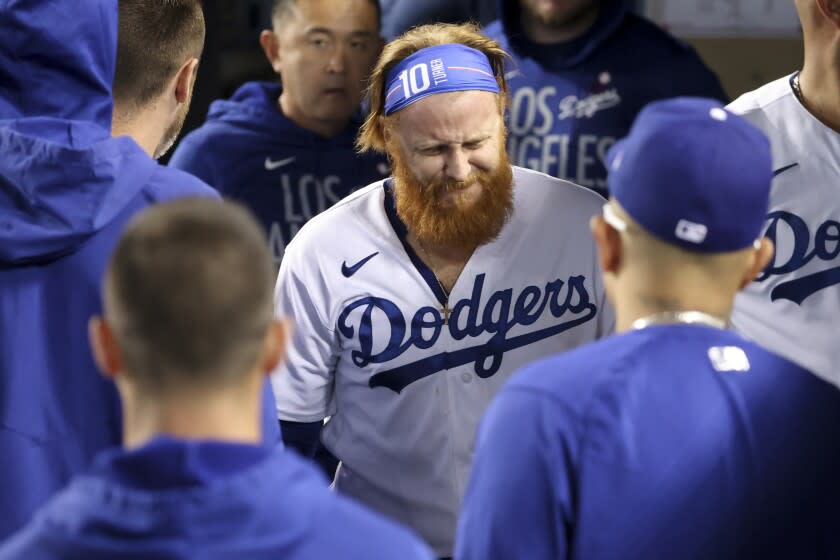 Los Angeles, CA - October 20: Los Angeles Dodgers third baseman Justin Turner walks in the dugout.