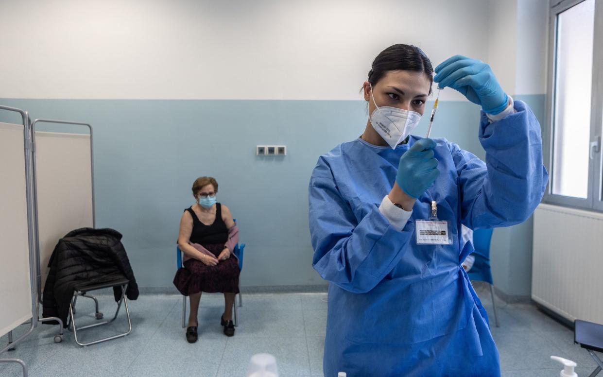 Pfizer's vaccine being administered in Milan, Italy. The EU's jab rollout has been slow - GETTY IMAGES