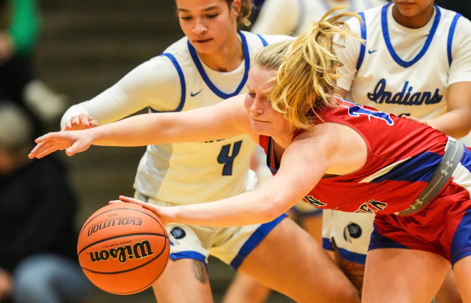 Indian Creek's Bre Gault (14) reaches for the ball Thursday, Oct. 5, 2023, during the Hall of Fame Classic girls basketball tournament at New Castle Fieldhouse in New Castle. Lake Central defeated Indian Creek, 51-45.