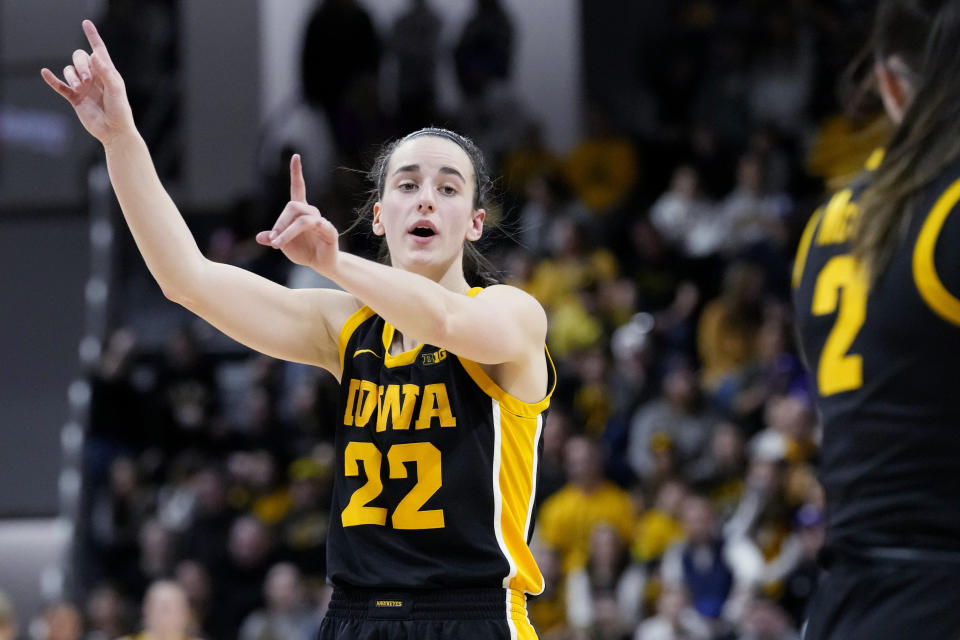 Iowa guard Caitlin Clark talks to teammates during the second half of an NCAA college basketball game against Northwestern in Evanston, Ill., Wednesday, Jan. 31, 2024. Iowa won 110-74. (AP Photo/Nam Y. Huh)