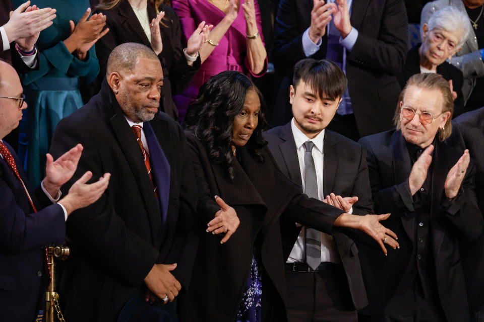 Rodney Wells and RowVaughn Wells, parents of Tyre Nichols, react as they are acknowledged alongside Brandon Tsay, hero of the Monterey, California, shooting, and Irish singer-songwriter Bono, during President Joe Biden's State of the Union address. / Credit: Getty Images