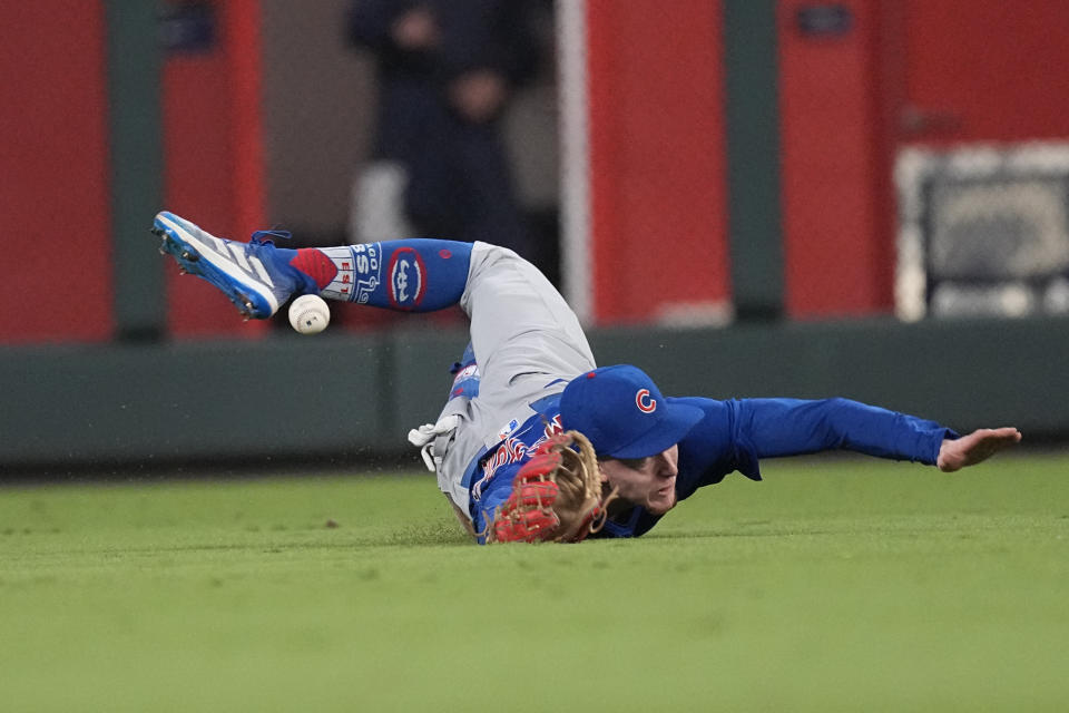 Chicago Cubs center fielder Pete Crow-Armstrong (52) can not reach a ball hit for a double by Atlanta Braves' Michael Harris II in the ninth inning of a baseball game, Wednesday, Sept. 27, 2023, in Atlanta. (AP Photo/John Bazemore)