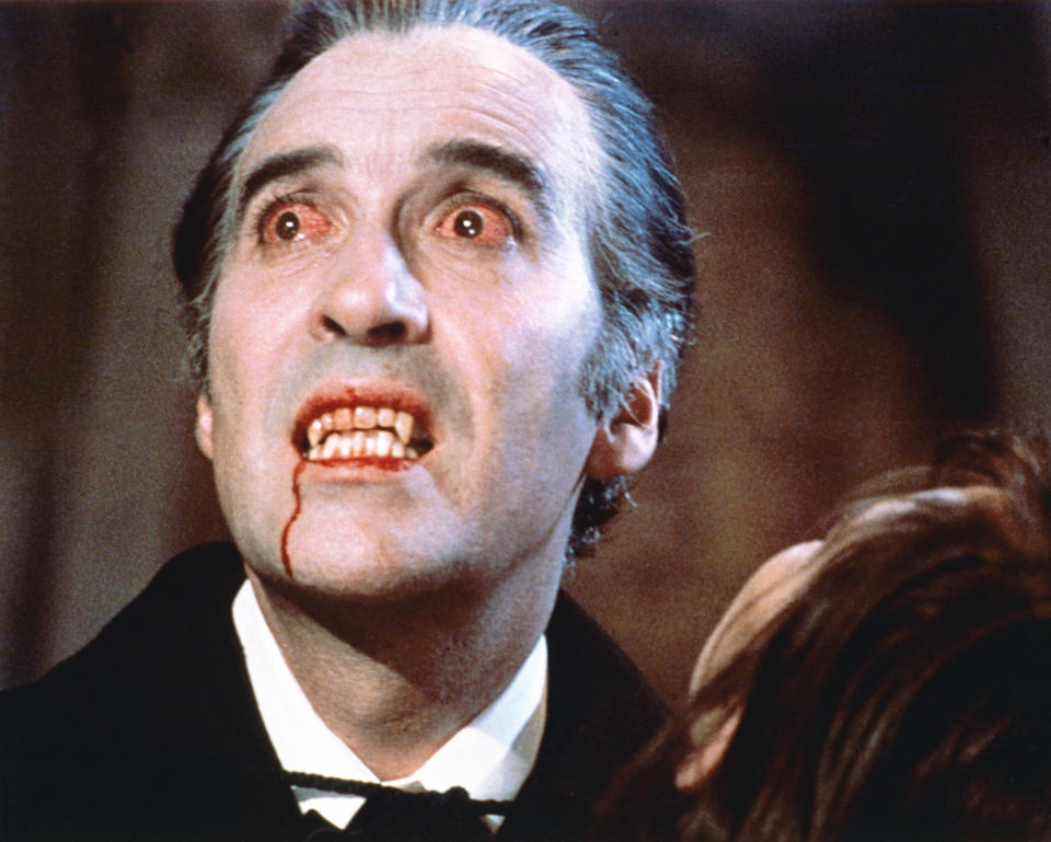 Christopher Lee, British actor, with bloodshot eyes and wearing pale facepaint and vampire's fangs in a publicity still issued for the flilm, 'Dracula', 1958. The Hammer horror film, directed by Terence Fisher (1904–1980), starred Lee as 'Dracula'. (Photo by Silver Screen Collection/Getty Images)