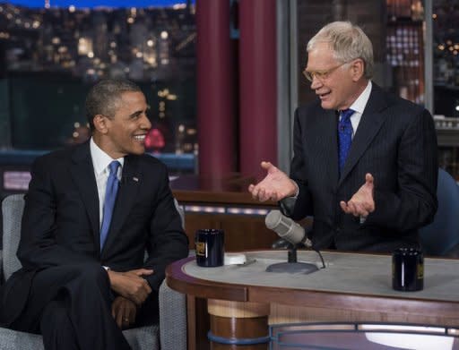 US President Barack Obama and David Letterman speak during the "Late Show with David Letterman" at the Ed Sullivan Theater on September 18, 2012 in New York, New York. The White House could barely suppress its glee after the first excerpts emerged on Monday evening with Romney saying 47 percent of Americans are essentially freeloaders who will vote for the president "no matter what."