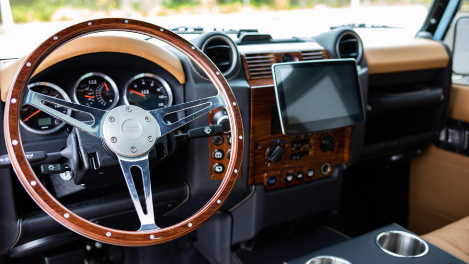The steering wheel and dashboard inside E.C.D. Automotive Design's Project Britton, an all-electric Defender 110 restomod.