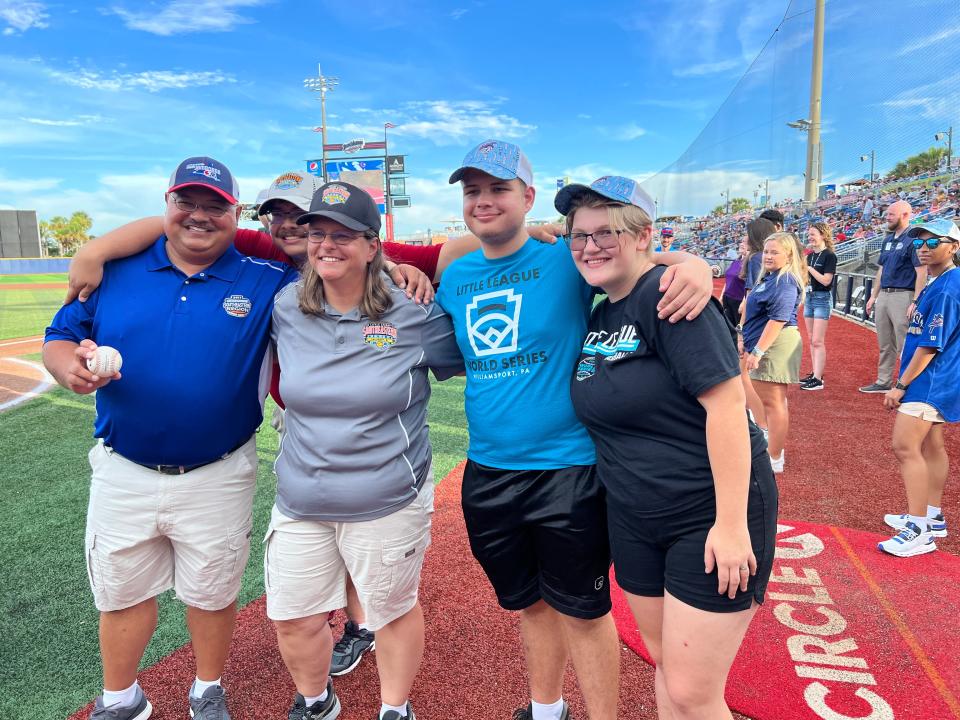 Bill Vikara, his wife Jessica, and two of his children gather at Blue Wahoos Stadium after Bill was honored for working the 75th Little League World Series which begins Wednesday in Williamsport, Pa.