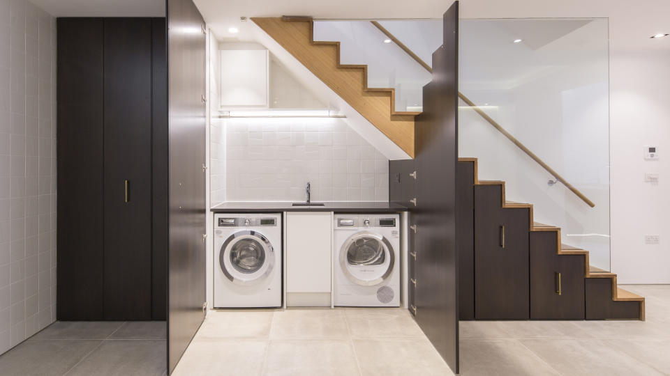 8. Put a small laundry room under the stairs