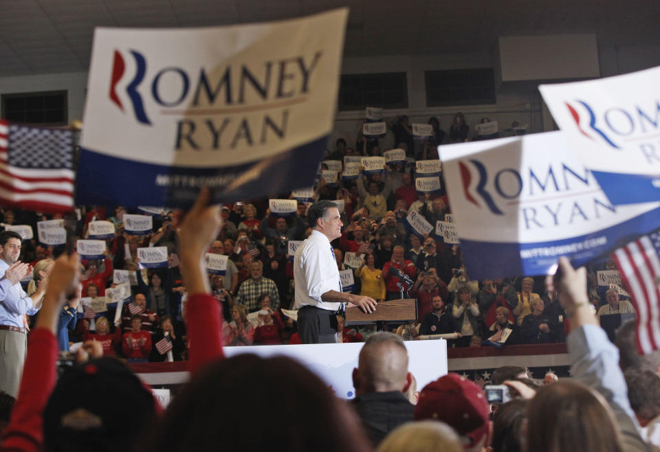 Republican presidential candidate and former Massachusetts Gov. Mitt Romney and vice presidential candidate Rep. Paul Ryan, R-Wis., left, campaign at the Veterans Memorial Coliseum, Marion County Fairgrounds, in Marion, Ohio, Sunday, Oct. 28, 2012. (AP Photo/Charles Dharapak)