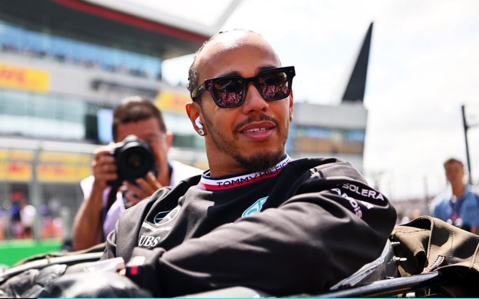 Lewis Hamilton of Great Britain and Mercedes looks on from the drivers parade prior to the F1 Grand Prix of Great Britain at Silverstone Circuit on July 09, 2023 in Northampton, England