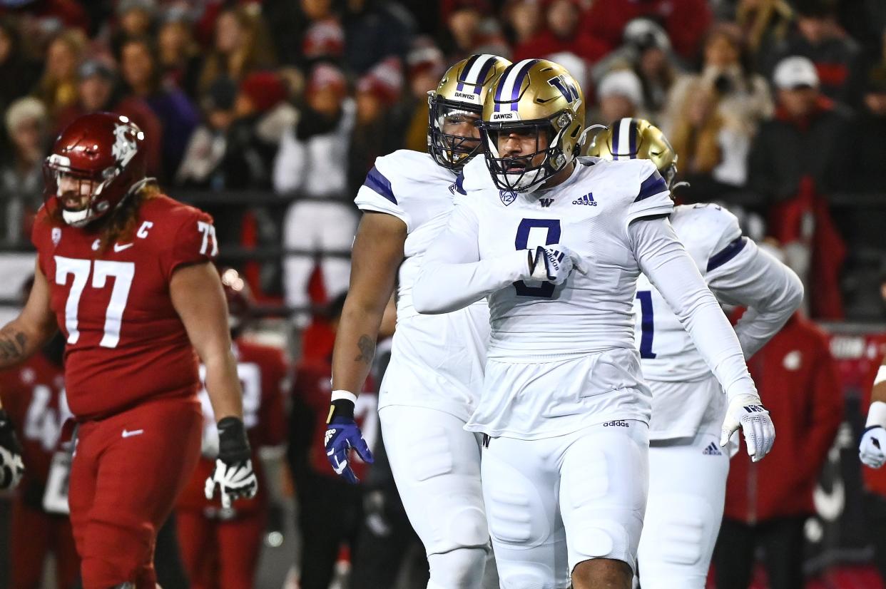 Washington defensive end Bralen Trice, right, is one of the Huskies' most dominant defensive players. This season Trice has 33 tackles, eight sacks and 11 tackles for loss. The Huskies play Texas in the Alamo Bowl on Dec. 29.