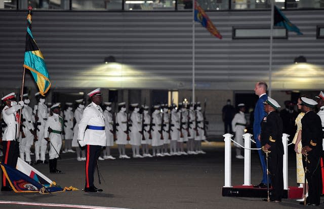 The then Duke of Cambridge observes the guard of honour during a departure ceremony at Lynden Pindling International Airport as he and the duchess of Cambridge departed the Bahamas at the end of their tour of the Caribbean taken on behalf of the Queen to mark her Platinum Jubilee in March