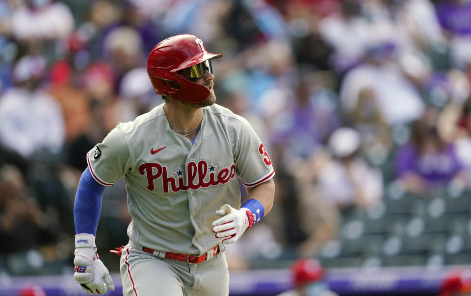 Philadelphia Phillies' Bryce Harper heads up the first-base line after flying out againt Colorado Rockies relief pitcher Robert Stephenson in the eighth inning of a baseball game Sunday, April 25, 2021, in Denver. Colorado won 12-2. (AP Photo/David Zalubowski)