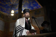 A rabbi prays during commemorative events marking the 80th anniversary of the Babi Yar massacre of Kyiv Jews perpetrated by German occupying forces in 1941 in Kyiv, Ukraine, Wednesday, Oct. 6, 2021. (Ukrainian Presidential Press Office via AP)