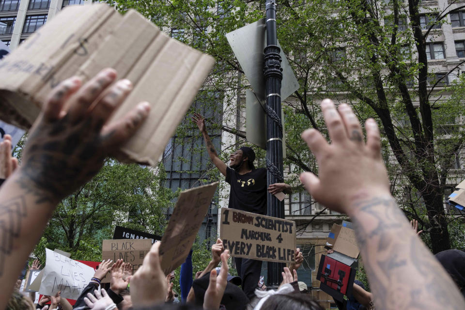 FILE - Protesters raise their hands near Foley Square, June 2, 2020, in New York, as part of a demonstration against police brutality sparked by the death of George Floyd, a Black man who died earlier that year after Minneapolis police officers restrained him. The death of Tyre Nichols in Memphis stands apart from some other police killings because the young Black man was beaten by Black officers. But the fact that Black officers killed a Black man didn’t remove racism from the situation. (AP Photo/Yuki Iwamura, File)