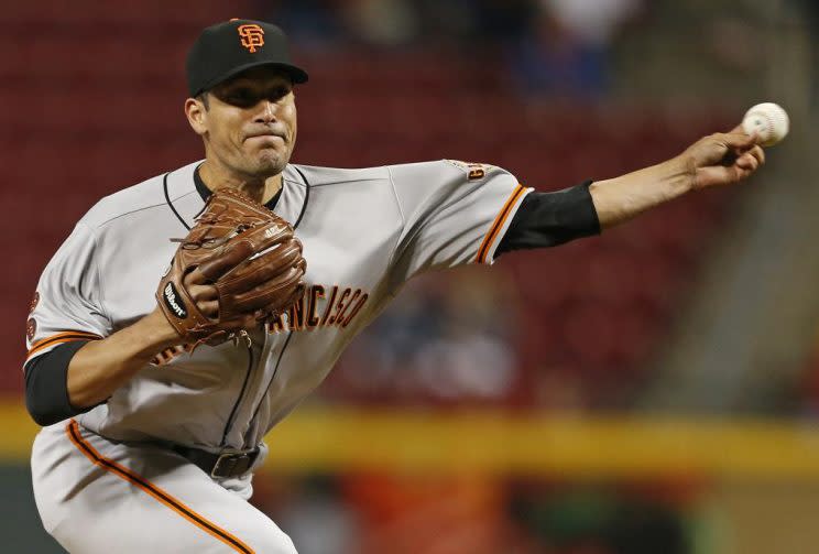 Javier Lopez is hanging up the cleats after 14 seasons, 839 appearances and four World Series championships. (AP)