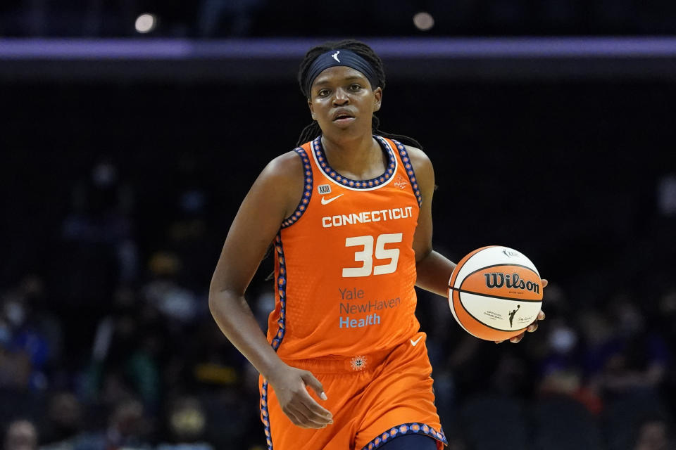 FILE - Connecticut Sun forward Jonquel Jones (35) controls the ball during the first half of a WNBA basketball game against the Los Angeles Sparks in Los Angeles, in this Thursday, Sept. 9, 2021, file photo. Jonquel Jones is no stranger to winning Associated Press WNBA awards. In previous years, the Connecticut Sun forward has been honored by the media that votes on the weekly AP WNBA power poll as the Sixth Woman of the Year and Most Improved Player. This year, the 6-foot-6 Jones is the unanimous choice AP Player of the Year honors by the 14-member panel, announced Wednesday, Sept. 22, 2021. (AP Photo/Ashley Landis, File)