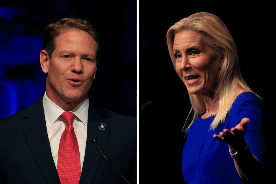 Jacksonville mayoral candidates Daniel Davis (left) and Donna Deegan appear during a debate on Thursday, April 20 at UNF’s Fine Arts Center in Jacksonville.