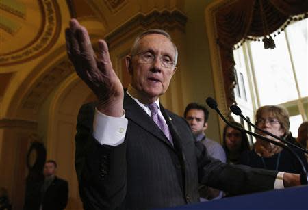 U.S. Senate Majority Leader Harry Reid (D-NV) gestures while speaking to the media following a Senate cloture vote on budget bill on Capitol Hill in Washington December 17, 2013. REUTERS/Yuri Gripas