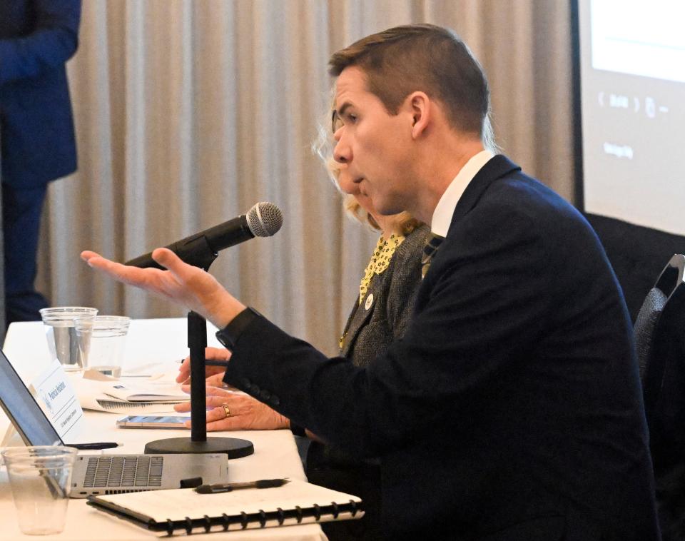 Daniel Doyle, the NRC's senior project manager for division of rulemaking , environmental and financial support, responds to Diane Turco of Harwich at the NRC hearing in Plymouth Monday evening.