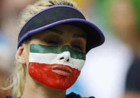 A fan of Iran reacts after the team was defeated by Bosnia in their 2014 World Cup Group F soccer match at the Fonte Nova arena in Salvador June 25, 2014. REUTERS/Ivan Alvarado