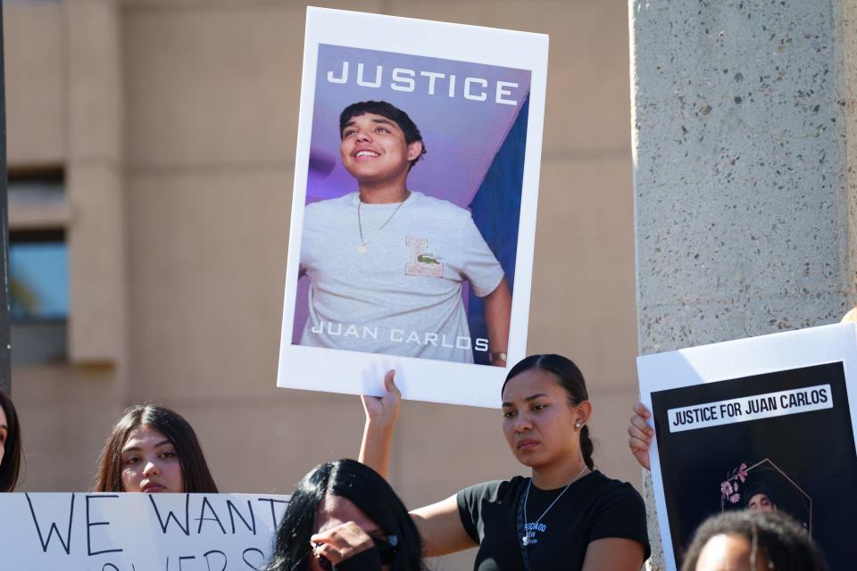 Family and friends gather outside the Glendale City Council Chambers on Oct. 13, 2022, to speak to the press about the death of 15-year-old Juan Carlos Bojorquez.