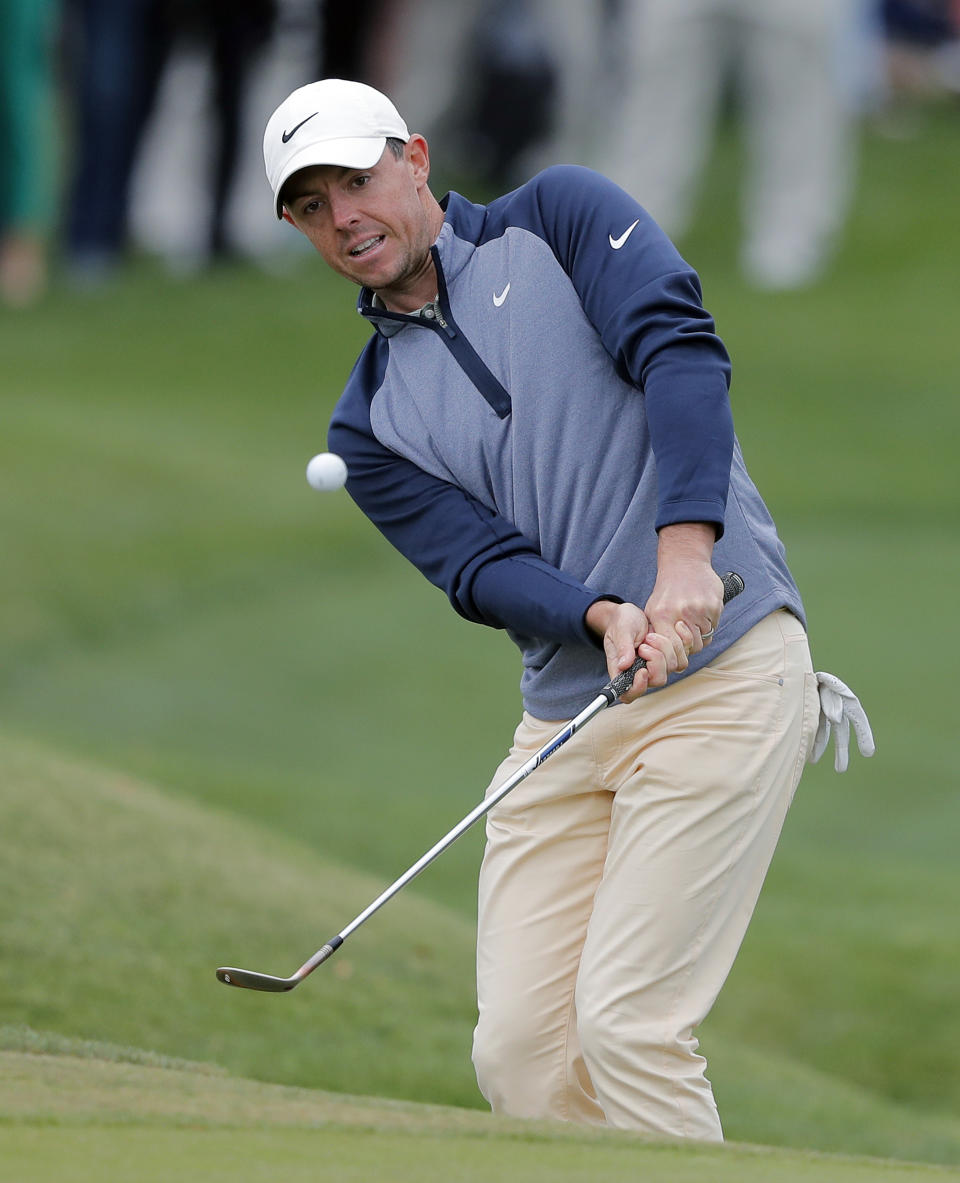 Rory McIlroy, of Northern Ireland, chips to the ninth green during the final round of The Players Championship golf tournament Sunday, March 17, 2019, in Ponte Vedra Beach, Fla. (AP Photo/Gerald Herbert)