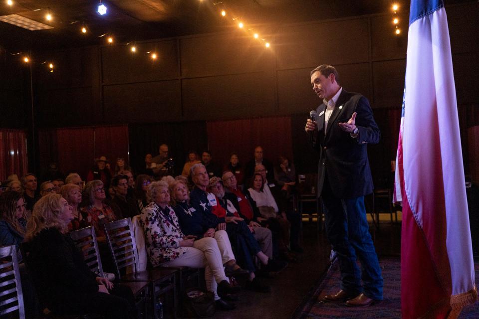 Tom Glass speaks to supporters during his campaign event in Bastrop on Jan. 24.