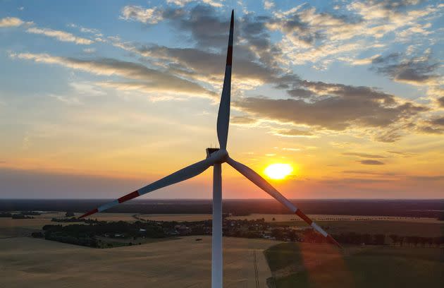 28 June 2021, Brandenburg, Jacobsdorf: A wind turbine in the sunset in the Oder-Spree district in East Brandenburg. The state of Brandenburg ranks second among the German states with the largest installed capacity of wind turbines. Thus, a good third of the electricity demand is generated from wind. With more than 7,400 megawatts (MW) of total installed capacity, Brandenburg now ranks second after Lower Saxony. Photo: Patrick Pleul/dpa-Zentralbild/ZB (Photo by Patrick Pleul/picture alliance via Getty Images) (Photo: picture alliance via Getty Images)