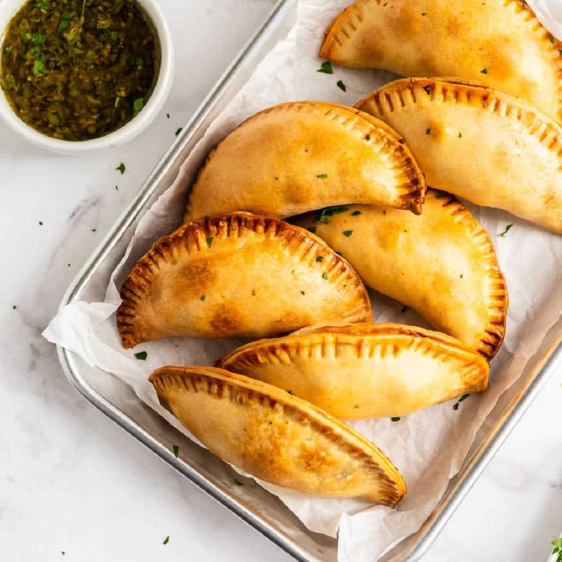 <p>Take Two Tapas</p><p>The filling is made with ground beef, onion, spices and green olives and baked in flaky empanada dough until golden brown.</p><p><strong>Get the recipe:</strong><a href="https://www.taketwotapas.com/beef-empanadas/" rel="nofollow noopener" target="_blank" data-ylk="slk:Beef Empanadas (Argentina);elm:context_link;itc:0;sec:content-canvas" class="link "> Beef Empanadas (Argentina)</a></p>