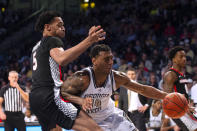 Georgia Tech forward Jalon Moore drives against Georgia center Frank Anselem in the second half of an NCAA college basketball game Tuesday, Dec. 6, 2022, in Atlanta. (AP Photo/Hakim Wright Sr.)