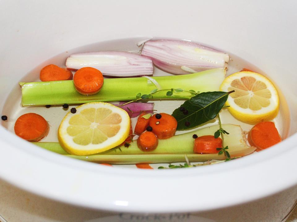 vegetables and lemon ingredients in slow cooker