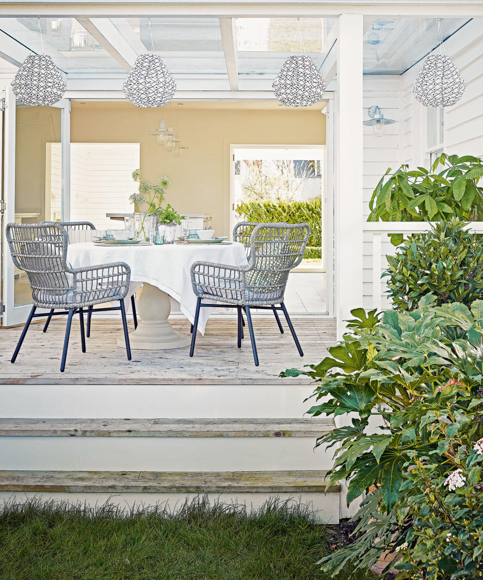 5. Use seasonal lighting to decorate your porch