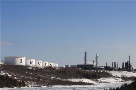 Storage containers and the Irving Oil refinery are seen in Saint John, New Brunswick, March 8, 2014. REUTERS/Devaan Ingraham