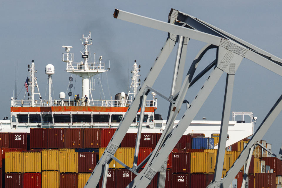 People are seen aboard the container ship Dali, Monday, April 15, 2024, in Baltimore. The FBI confirmed that agents were aboard the Dali conducting court-authorized law enforcement activity. (AP Photo/Julia Nikhinson)