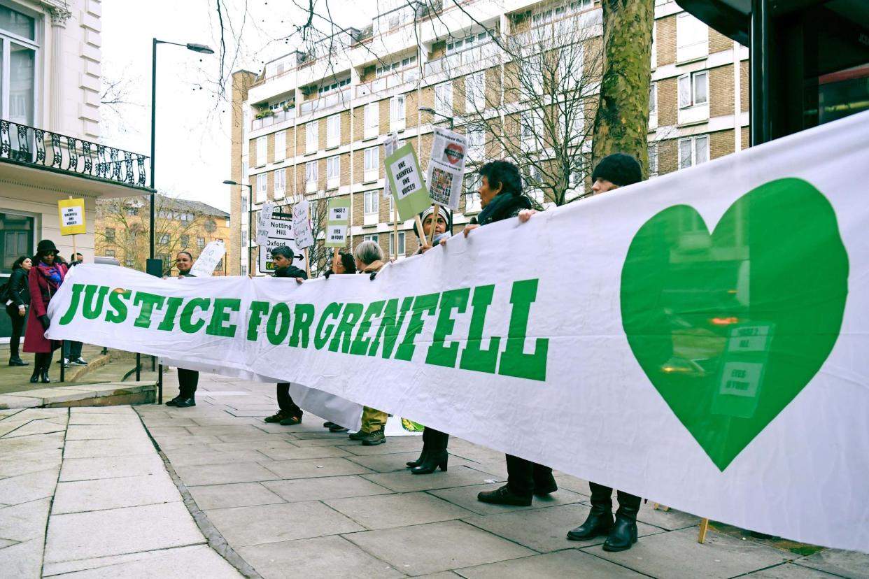 Protesters outside the Grenfell Tower public inquiry in London: PA