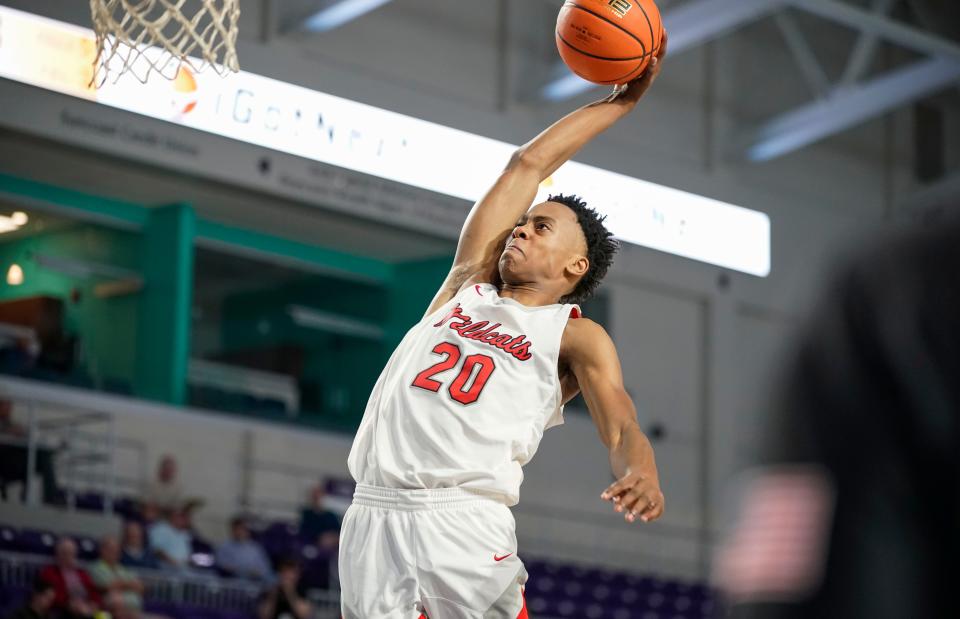 Lake Highlands Wildcats guard Tre Johnson (20) goes up for a dunk during the second half of a game against the Newton Rams during the 49th annual City of Palms Classic at Suncoast Arena in Ft. Myers on Friday, Dec. 16, 2022.