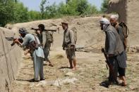 Afghan militia forces battle Taliban militants on the outskirts of Kunduz in May 2015