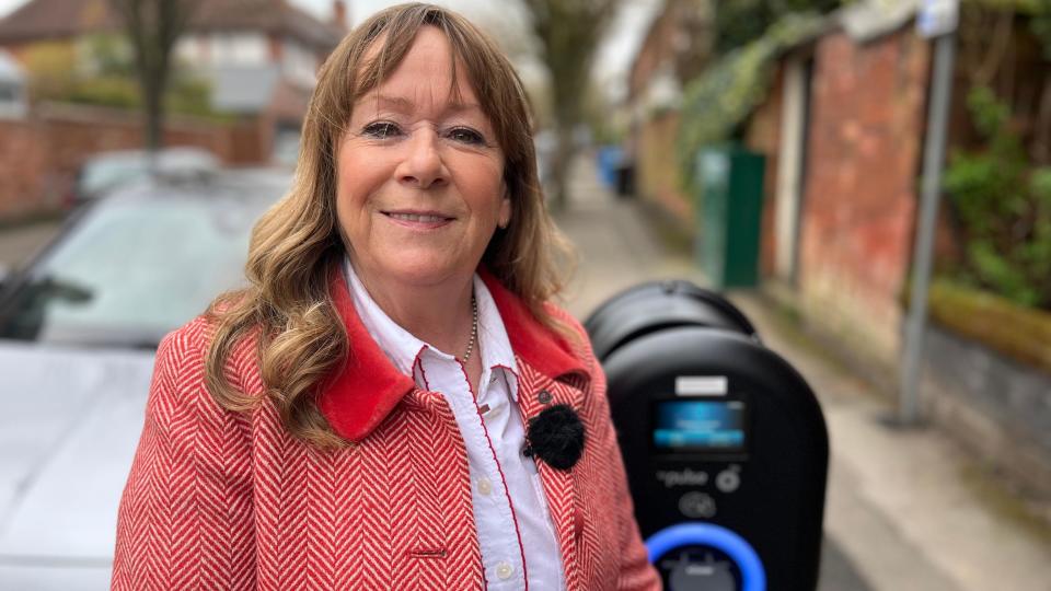 Councillor Carmel Swan and a charge point