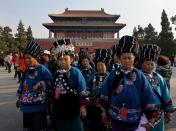Miao minority tourists from China's Hunan province leave the Forbidden City in Beijing, on March 19, 2014