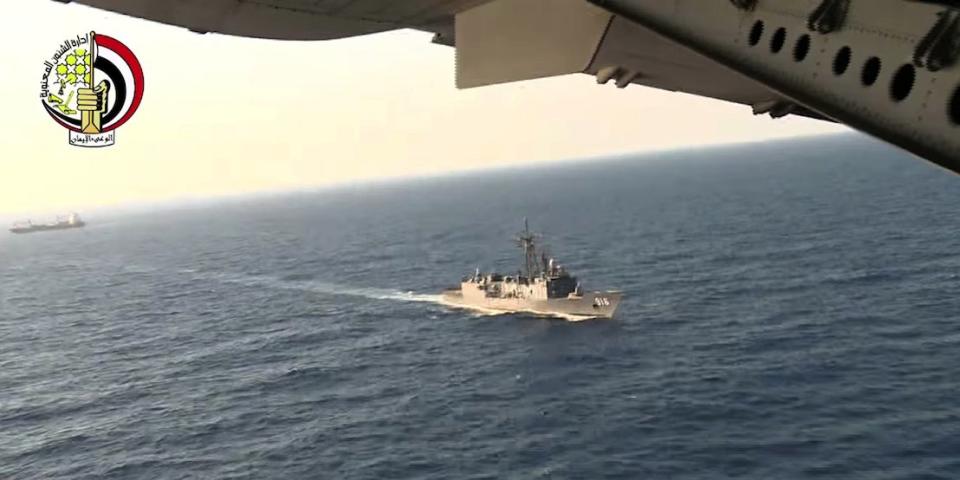 In this Thursday, May 19, 2016 video image released by the Egyptian Defense Ministry, an Egyptian plane flies over an Egyptian ship during the search in the Mediterranean Sea for the missing EgyptAir flight 804 plane