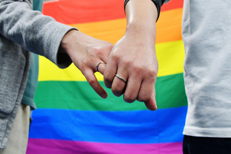 Plaintiffs pose for photo during a press conference after the same-sex marriage lawsuit in front of Sapporo District Court in Sapporo, Hokkaido Prefecture, on March 17, 2021.<span class="copyright">The Yomiuri Shimbun/AP</span>