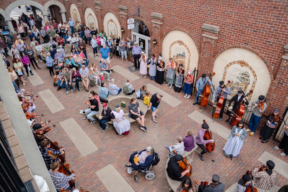 The Strolling Strings of the Pella High School Orchestra perform during the annual Tulip Time celebration, Friday, May 5, 2023. 