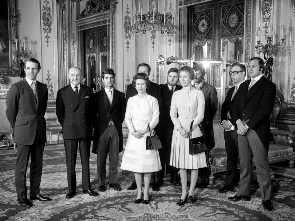 The Queen and Princess Anne with the seven men involved in saving the princess on the night of the kidnapping