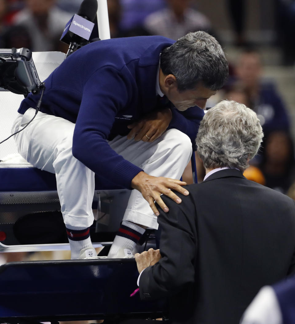 Chair umpire Carlos Ramos, left, talks with referee Brian Earley during the women's final of the U.S. Open tennis tournament between Serena Williams and Naomi Osaka, of Japan, Saturday, Sept. 8, 2018, in New York. (AP Photo/Adam Hunger)