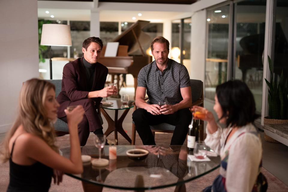 A stylish couple (Perry Mattfeld, from left, and Timothy Granaderos) just won't go home after a party thrown by their new neighbors (Ryan Hansen and Melissa Tang) in the horror comedy "Who Invited Them."