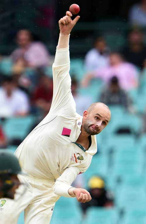 Australian spinner Nathan Lyon sends down a delivery to a West Indies' batsman on the first day of their third Test match, in Sydney, on January 3, 2016