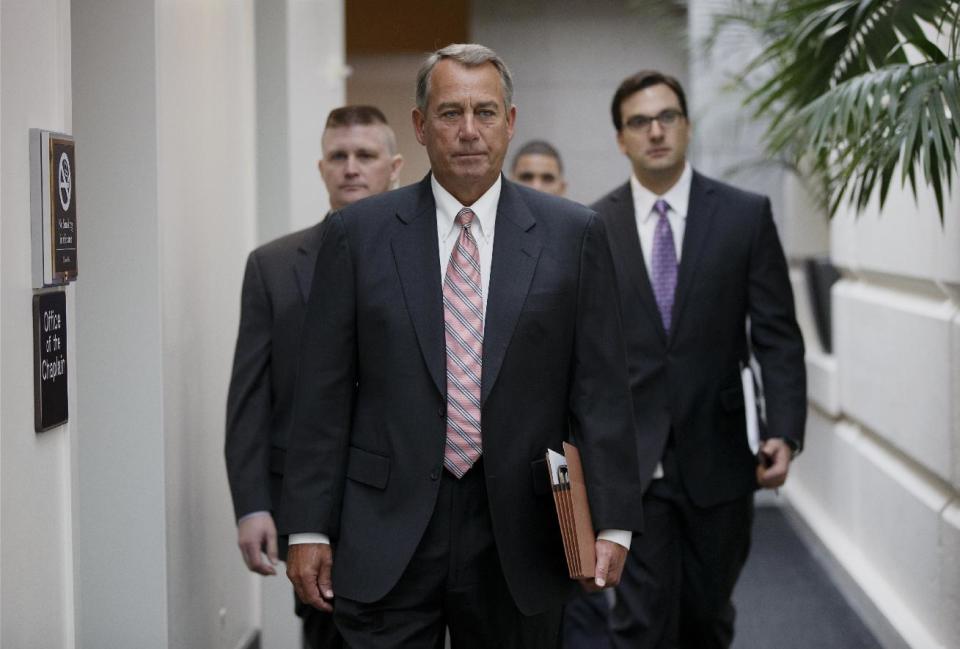 House Speaker John Boehner of Ohio, walks to the weekly House Republican Conference on Capitol Hill in Washington, Wednesday, March 12, 2014. After months of railing against President Barack Obama's health care overhaul, Republicans scored a key victory in a hard-fought congressional race in a Florida special election Tuesday that largely turned on the federal health care law and that had been closely watched as a bellwether of midterm elections in November. (AP Photo/J. Scott Applewhite)