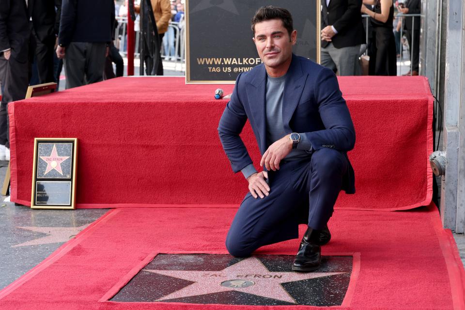 Zac Efron poses with his star during his Hollywood Walk of Fame Star Ceremony on December 11, 2023 in Hollywood, California. (Photo by Leon Bennett/Getty Images