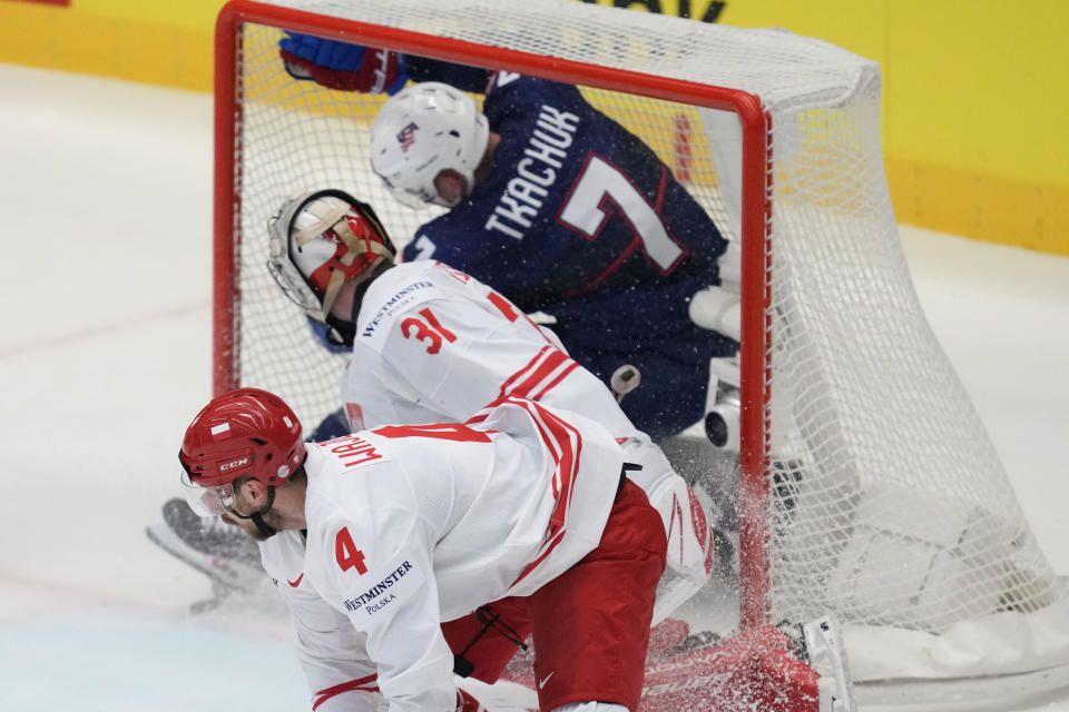 Unted States' Brady Tkachuk, top, scores his side's second goal during the preliminary round match between Poland and United States at the Ice Hockey World Championships in Ostrava, Czech Republic, Friday, May 17, 2024. (AP Photo/Darko Vojinovic)
