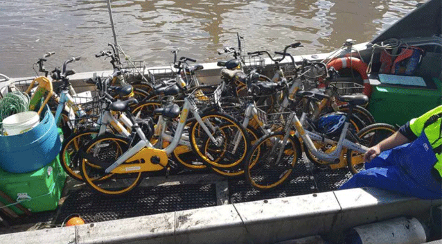 The operation collected a mountain of bikes aboard a Yarra River boat. Source: oBike Australia/ Facebook